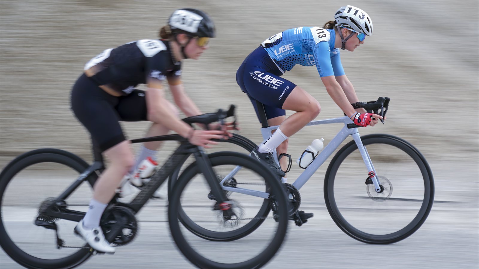 Cyclists riding in a group on a country road