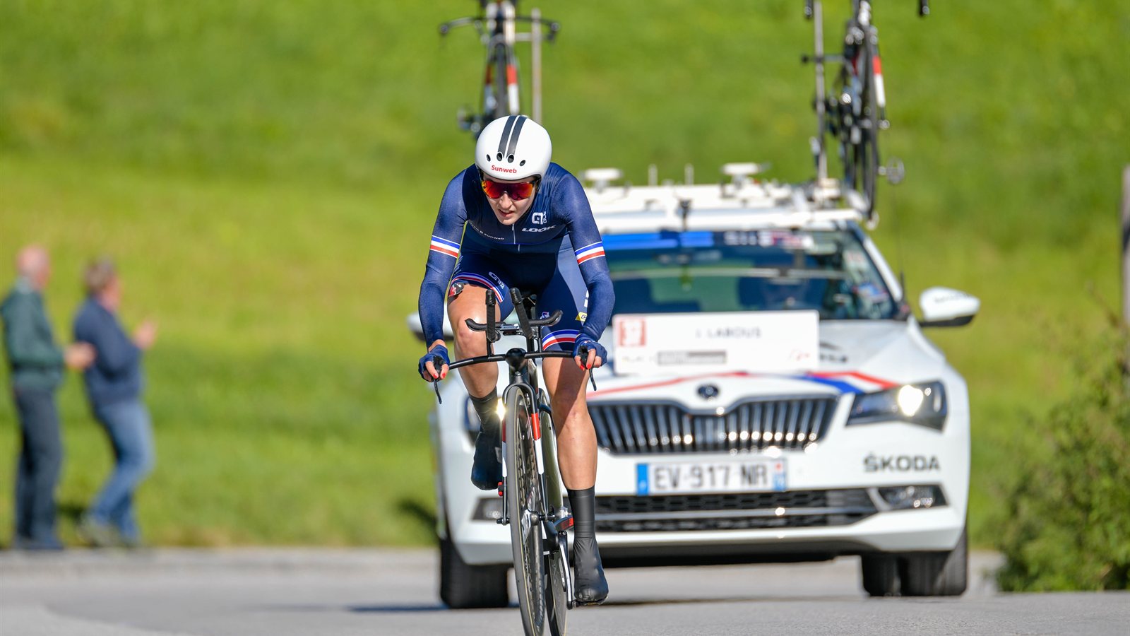 Time trial cyclist racing on an open road